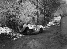 SS Jaguar 100 taking part in a motoring trial, late 1930s. Artist: Bill Brunell
