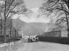 SS Jaguar 100 of Mrs IW McLennan competing in the RAC Rally, 1939. Artist: Bill Brunell