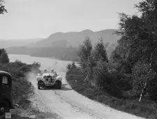 SS Jaguar 100 open 2-seater of Miss E Violet Watson competing in the RSAC Scottish Rally, 1939. Artist: Bill Brunell