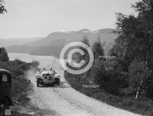 SS Jaguar 100 open 2-seater of Miss E Violet Watson competing in the RSAC Scottish Rally, 1939. Artist: Bill Brunell.