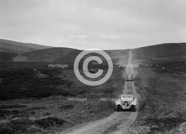 SS Jaguar 100 open 2-seater and Humber saloon competing in the RSAC Scottish Rally, 1939. Artist: Bill Brunell.
