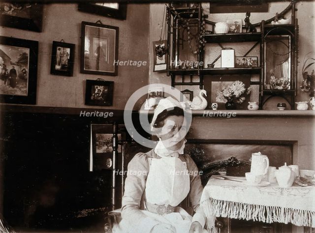 St Bartholomew's Hospital, London: a nurse taking tea, c1890. Creator: Unknown.