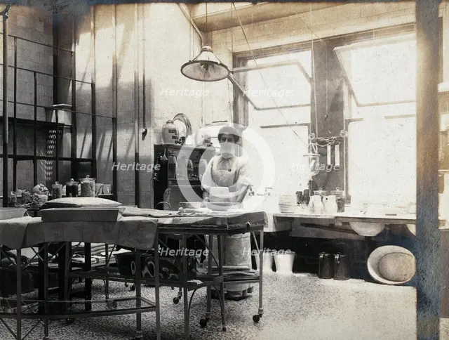 St Bartholomew's Hospital, London: nurse in operating theatre, c1890. Creator: Unknown.