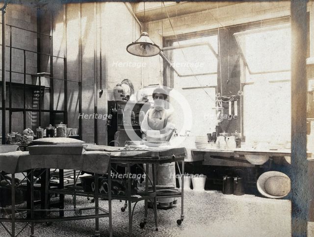 St Bartholomew's Hospital, London: nurse in operating theatre, c1890. Creator: Unknown.