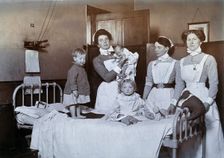 St Bartholomew's Hospital, London: nurses and children in casualty, c1890. Creator: Unknown
