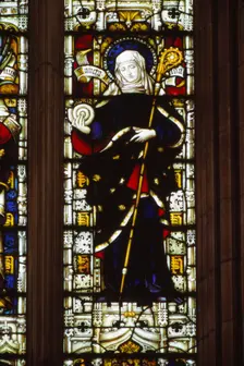 St. Hilda of Whitby holding an ammonite, West window, Hereford Cathedral, 20th century. Artist: CM Dixon