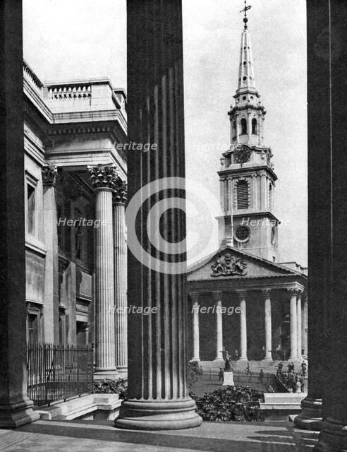 St Martin-in-the-Fields seen between the columns of the National Gallery, London, 1926-1927.Artist: McLeish