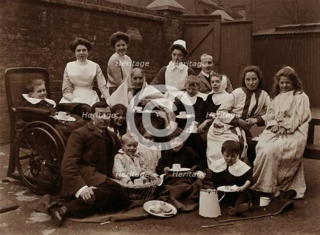 St Mary's Hospital, Plaistow: Basil Hood and Robert Archibald with patients and nurses..., 1904. Creator: Unknown.