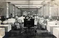 St Marylebone Infirmary, London: ward with nurses and patients, 1910. Creator: Unknown