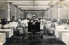 St Marylebone Infirmary, London: ward with nurses and patients, 1910. Creator: Unknown