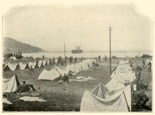 "St. Paul" in Bay, firing over Top of Hill...June 24th Spanish-American War, 1898, (1899). Creator: Burr McIntosh
