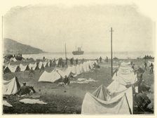 "St. Paul" in Bay, firing over Top of Hill...June 24th Spanish-American War, 1898, (1899). Creator: Burr McIntosh