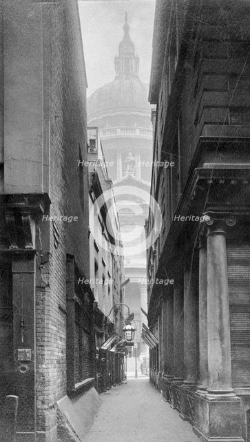 St Paul's Cathedral seen through a narrow courtyard, City of London. Creator: Unknown.