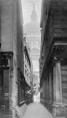 St Paul's Cathedral seen through a narrow courtyard, City of London. Creator: Unknown