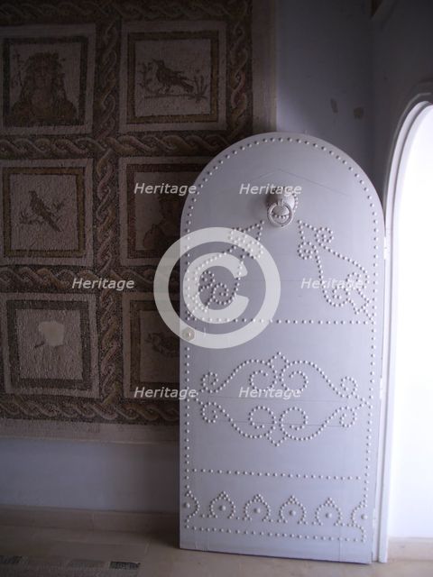Studded door and mosaic, El Jem Museum, El Djem, Tunisia, 2009. Creator: Amanda Waite.