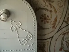 Studded door and mosaic, El Jem Museum, El Djem, Tunisia, 2009. Creator: Amanda Waite
