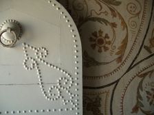 Studded door and mosaic, El Jem Museum, El Djem, Tunisia, 2009. Creator: Amanda Waite