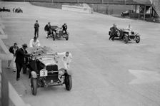 Studebaker and two OMs at the JCC Double Twelve Race, Brooklands, Surrey, 1929. Artist: Bill Brunell