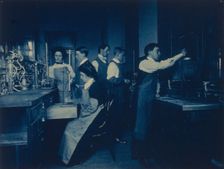 Students conducting experiments in laboratory, Western High School, Washington, D.C., (1899?). Creator: Frances Benjamin Johnston