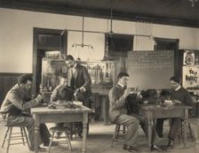 Students constructing telephones at Hampton Institute, 1899 or 1900. Creator: Frances Benjamin Johnston