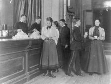 Students getting beverages from a counter, Western High School, Washington, D.C., (1899?). Creator: Frances Benjamin Johnston