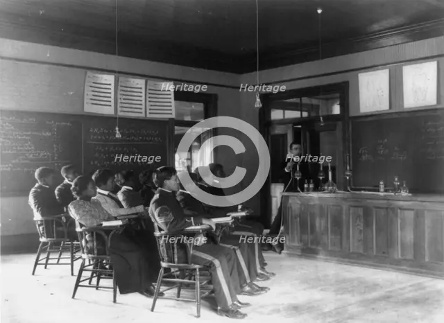Students in class learning how to prepare sulphuric acid, Hampton Inst..,  Va., between 1899 & 1900. Creator: Frances Benjamin Johnston.