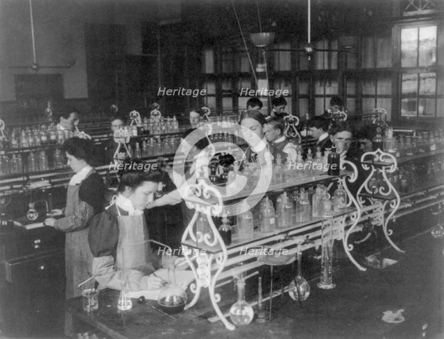 Students in a chemistry class conducting an experiment, Western High School, Washington DC, (1899?). Creator: Frances Benjamin Johnston.