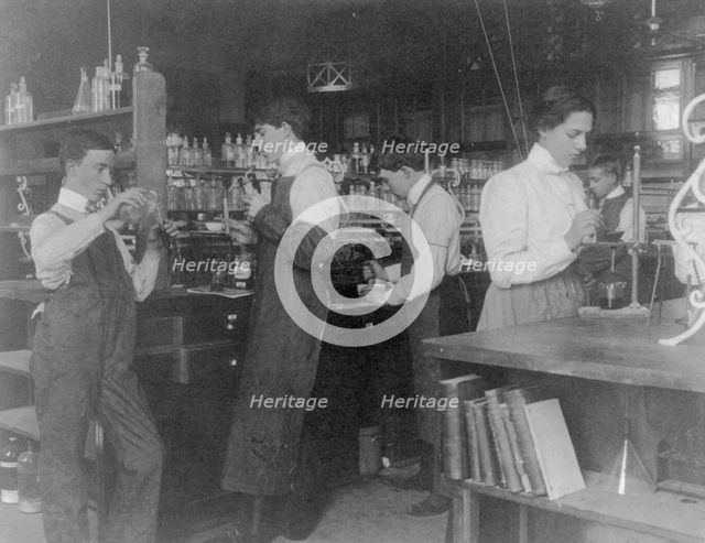 Students in a chemistry class conducting an experiment, Western High School, Washington DC, (1899?). Creator: Frances Benjamin Johnston.