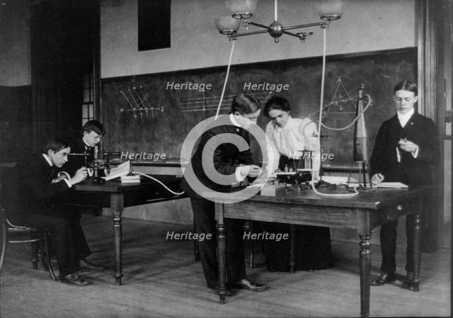 Students in a science class conducting experiments, Western High School, Washington, D.C., (1899?). Creator: Frances Benjamin Johnston.
