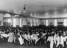 Students in dining hall, United States Indian School, Carlisle, Pa., 1901. Creator: Frances Benjamin Johnston