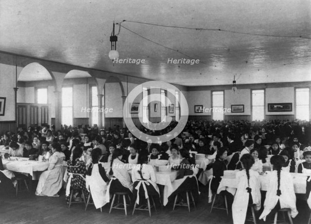 Students in dining hall, United States Indian School, Carlisle, Pa., 1901. Creator: Frances Benjamin Johnston.