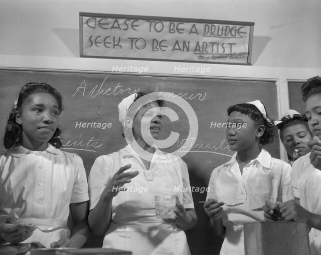 Students in the home economics class, Daytona Beach, Florida, 1943. Creator: Gordon Parks.