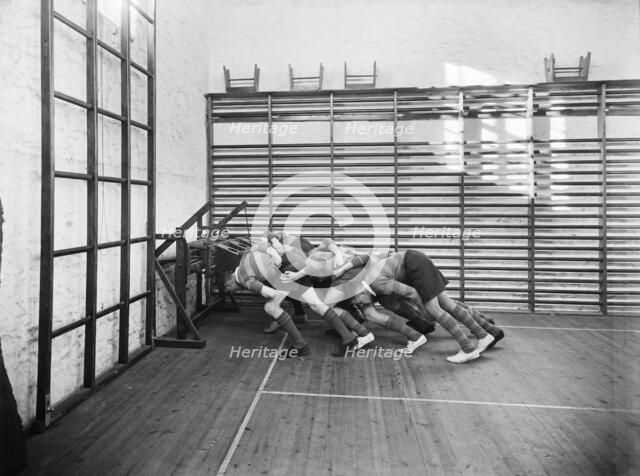 Students practicing rugby scrummaging, Launceston College, Cornwall, 1930s. Artist: Marshall Keene and Company.