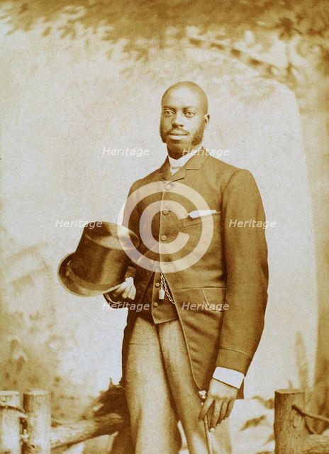 Studio portrait of man with top hat and cane, c1880-c1889. Creator: George E. Curtis.