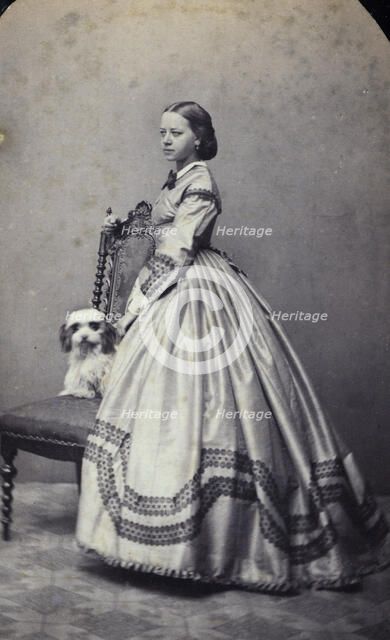 Studio portrait of an 18 year old girl in an ankle-length dress, c1856. Artist: Unknown