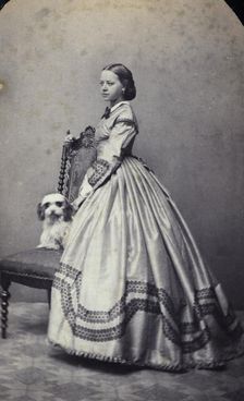 Studio portrait of an 18 year old girl in an ankle-length dress, c1856