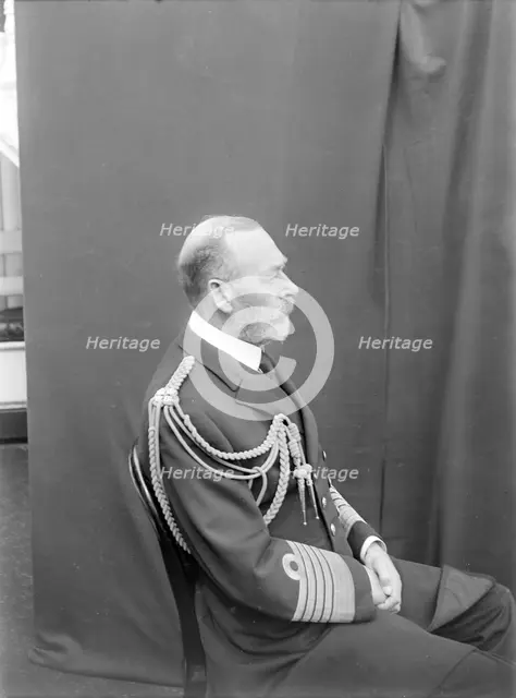 Studio portrait of George V taken aboard 'HMY Victoria and Albert', c1935. Creator: Kirk & Sons of Cowes.