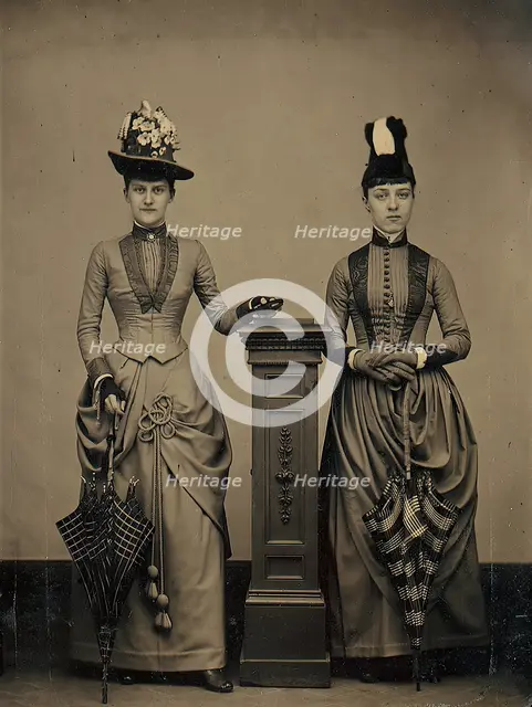 Studio Portrait of Two Women Holding Folded Parasols, ca. 1885. Creator: Unknown.