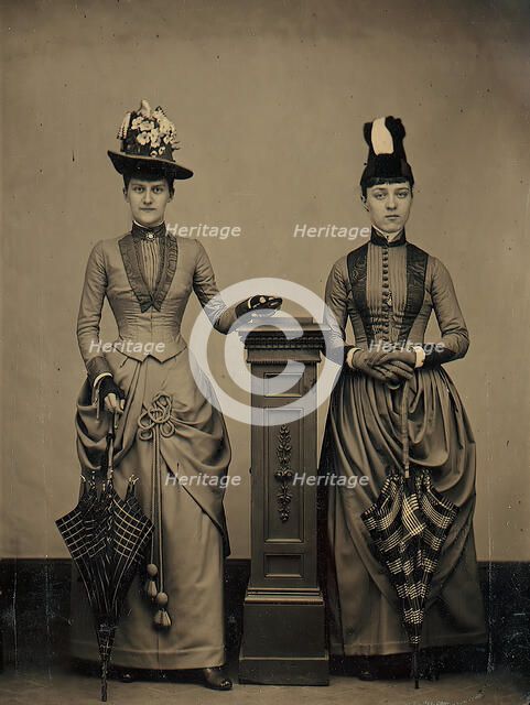 Studio Portrait of Two Women Holding Folded Parasols, ca. 1885. Creator: Unknown.