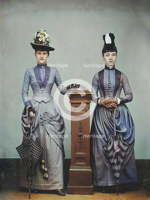 Studio Portrait of Two Women Holding Folded Parasols, ca. 1885. Creator: Unknown.
