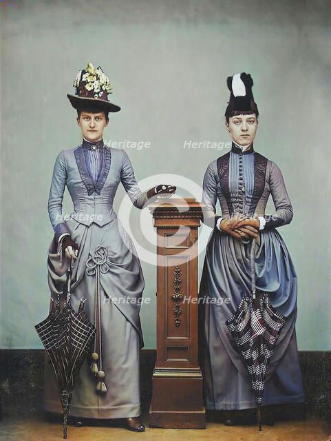 Studio Portrait of Two Women Holding Folded Parasols, ca. 1885. Creator: Unknown.