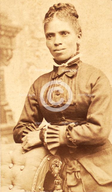 Studio portrait of unidentified woman, arms on back of chair, c1880-c1889. Creator: Richmond Photograph Co.