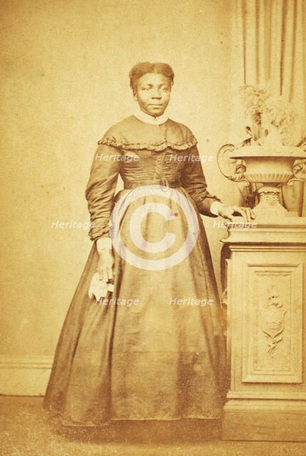 Studio portrait of unidentified  woman holding handkerchief, c1860-c1869. Creator: Sims Photograph Gallery.