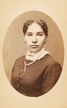 Studio portrait of young woman wearing chain necklace, c1880-c1889. Creator: Unknown