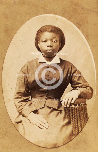 Studio portrait of young woman with thin ribbon around neck, (1880-1889?). Creator: A. T. Hunt.