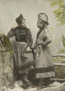 Studio portrait:Two young Sami women dressed in black, 1890-1899. Creator: Helene Edlund