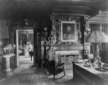 Study with portrait of woman in Elizabethan dress, over fireplace..., Greenwich, Connecticut, 1908. Creator: Frances Benjamin Johnston