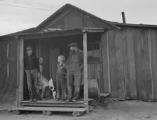 Stump farm family and their present home, Boundary County, Idaho, 1939. Creator: Dorothea Lange