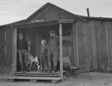 Stump farm family and their present home, Boundary County, Idaho, 1939. Creator: Dorothea Lange