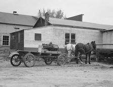 Stump farmer comes to town on a Saturday morning to bring in cream..., Bonners Ferry, Idaho, 1939. Creator: Dorothea Lange